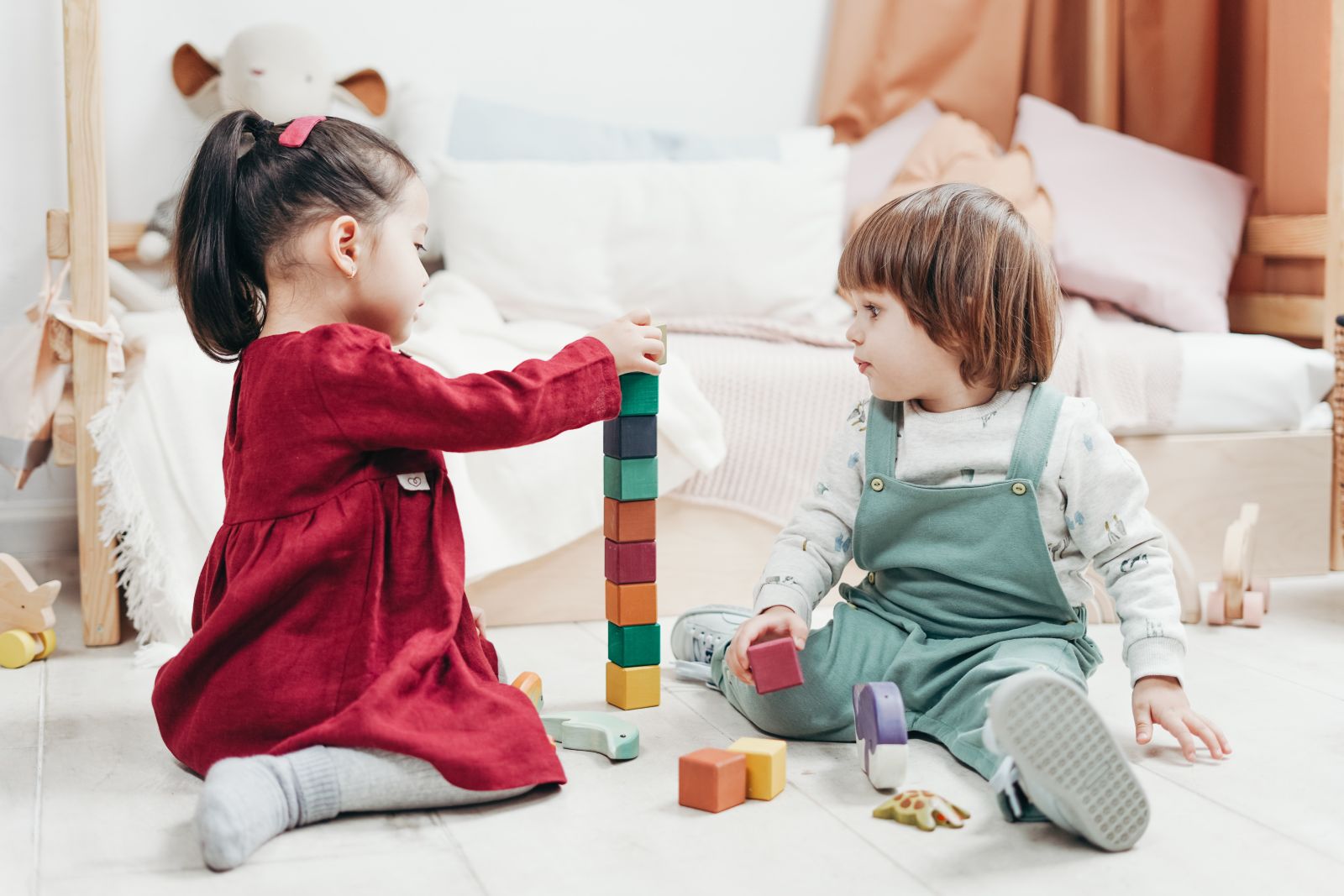 Kids playing wooden blocks together